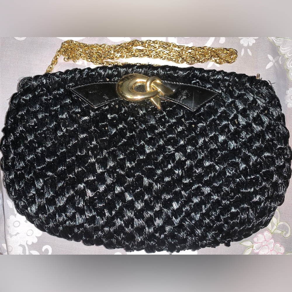 Black crafted with a woven raffia design women’s crossbody bag